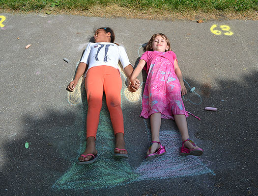 Kids are invited to decorate the sidewalks at Garfield Park by creating works of art with colorful chalk.
